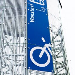 Sign on the façade of an automated bicycle parking tower