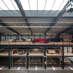 A museum with a parking system for cars and classic cars