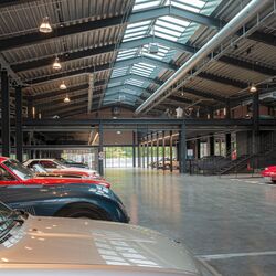 An overview of the museum hall displaying the cars