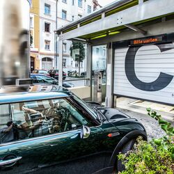 A car drives through an entry gate