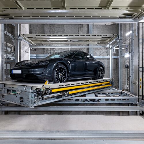The car is parked on the platform within the parking system