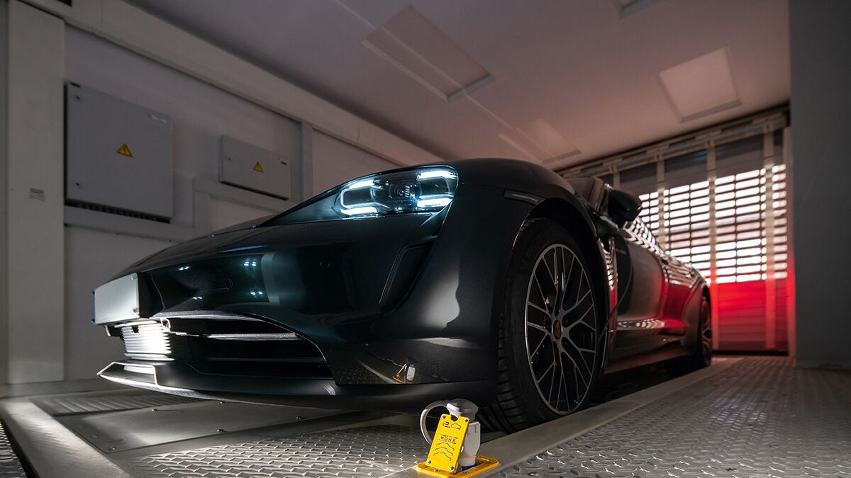 The car is positioned in an entry bay on a parking platform