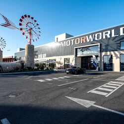 Exterior view of Motorworld Mallorca with the car park in front