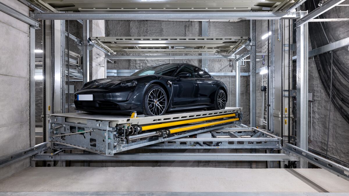 The car is parked on the platform within the parking system