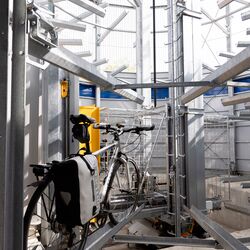 Bicycle on a rail in an automatic bicycle parking system
