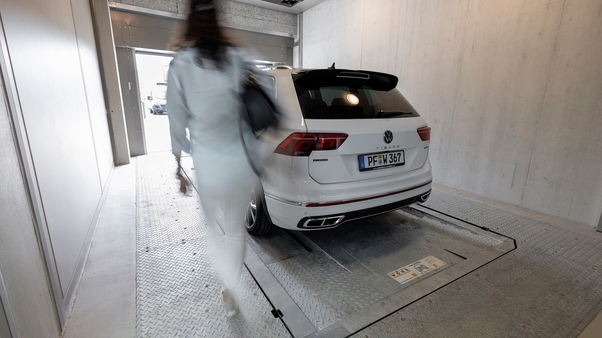 The car is parked in the entry bay of a parking system