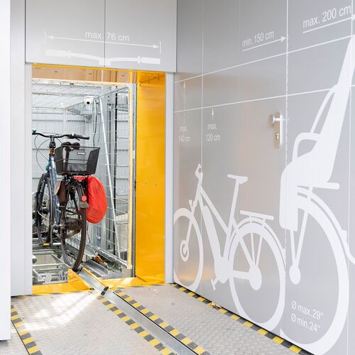 Bicycle on a rail in an automatic bicycle parking system