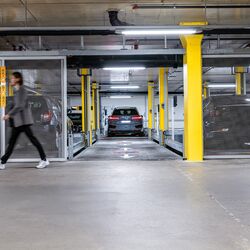 Front view of the parking system, showing a car parked in a parking space