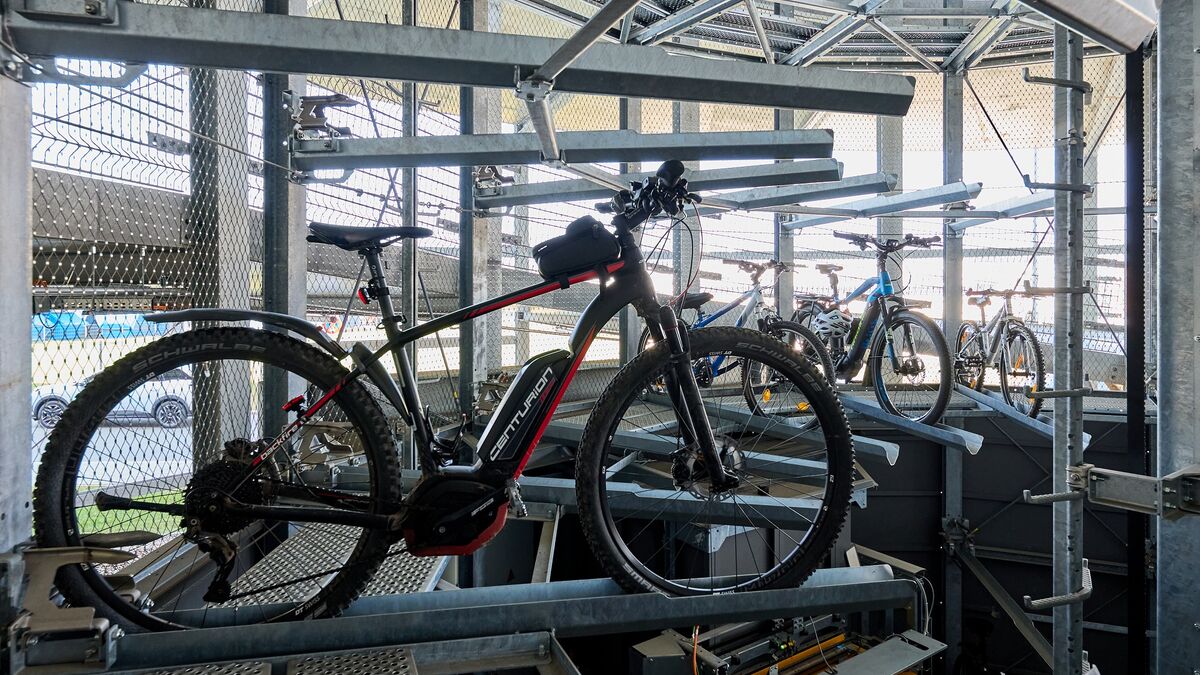 A bicycle on a rail in an automated bicycle parking system