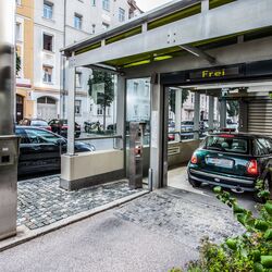 The car is in an entry bay of a car park system
