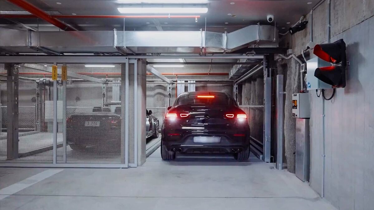 A car drives into a car parking system