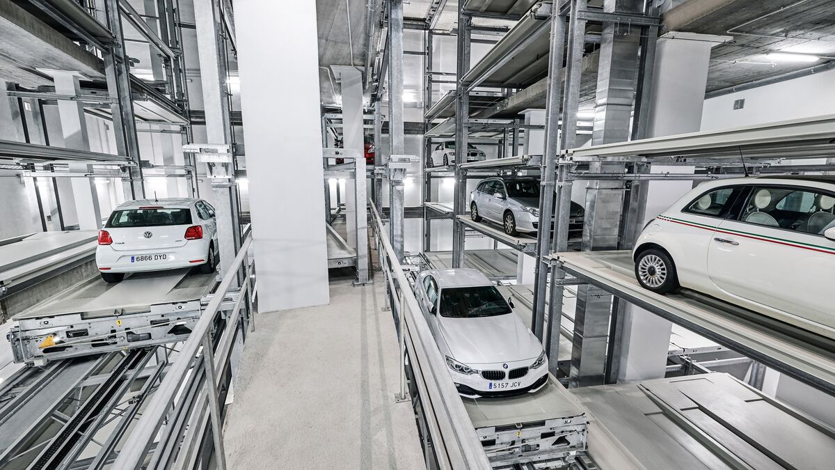 The cars are parked in a rack system