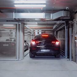 A car drives into a car parking system