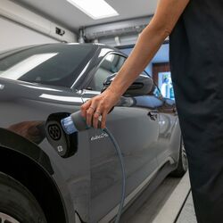 The car is positioned in an entry bay on a parking platform