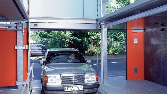 The car drives into the entrance bay of the Parksafe