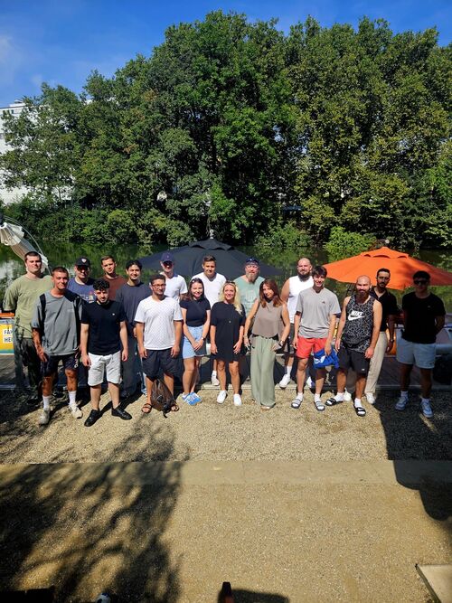 Group photo of several people in a wood
