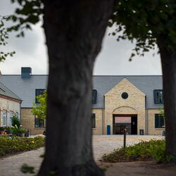 Historic building with trees in the foreground