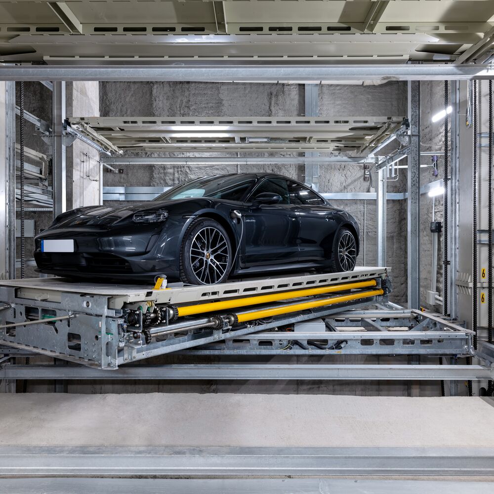 The car is parked on the platform within the parking system