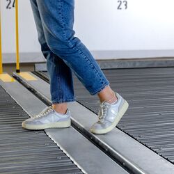 A person walks across two parking platforms