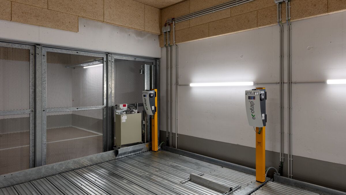 Electric charging points are located on a parking system