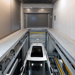 The car descends into the underground car park