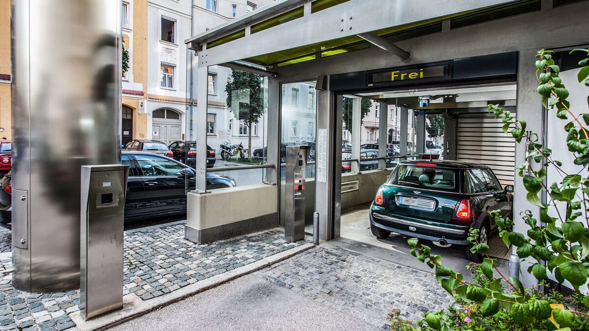 The car is in an entry bay of a car park system